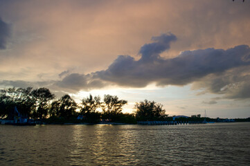 Wall Mural - sun setting over the gulf of mexico from the point of view of a viewer on a boat.