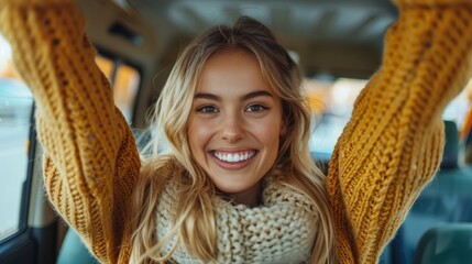 Joyful European woman celebrating successful car purchase, gesturing YES and shouting, sitting inside auto