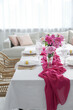 © New Africa - Beautiful table setting with pink peonies in dining room