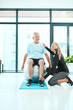 © Penn/peopleimages.com - Senior man, woman and physiotherapy in workout or training in elderly care, retirement and fitness center for healing. Physiotherapist, patient and exercise in yoga ball, rehabilitation and trainer