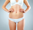 © Sanc/peopleimages.com - Body, stomach and underwear with model in studio on gray background for health or wellness. Abdomen, diet and transformation with figure of women in bra and panties for cosmetics or losing weight