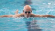 © Pist L. - Senior Man Swimming Laps in a Pool for Fitness and Competitive Training