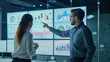 © Mmmdrza - Analysts working with interactive dashboards displaying real-time data, charts, and graphs. Emphasize the role of big data and AI in driving business insights and decision-making.