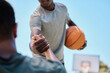 © Irshaad Majal/peopleimages.com - Basketball, help and team on a court playing a match, training or practicing together for a competition. Fitness, sports and man helping his friend on a basketball court during a game or practice.