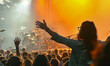 © Bartek - Energetic Crowd Enjoying Live Music Festival at Sunset, People Cheering and Dancing in Front of Stage with Vibrant Lights, Celebrating Summer Outdoor Concert