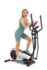 Sticker - Surprised young woman training on exercising bike against white background