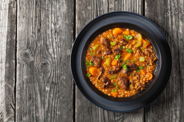 Poster - beef barley soup in a bowl, top view