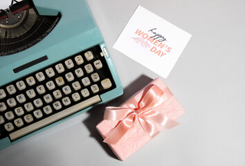 Sticker - Vintage typewriter, gift box and postcard for Women's Day on grey background