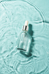 Wall Mural - Serum bottle in the water with waves. Top view.