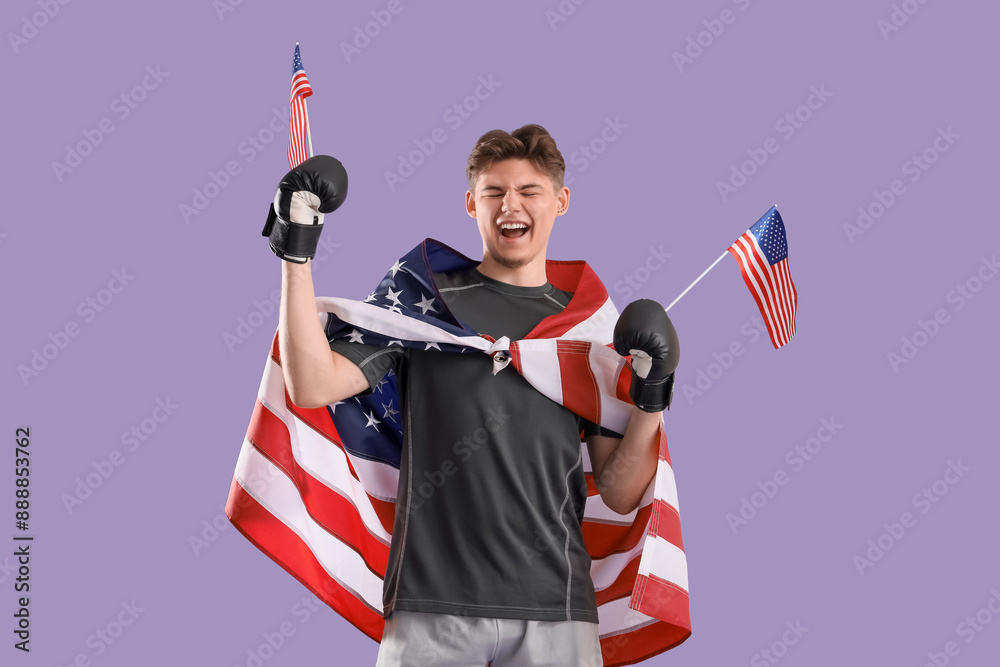Male boxer with USA flags and boxing gloves on lilac background