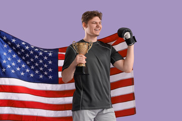 Sticker - Male boxer with USA flag, golden cup and boxing glove on lilac background