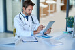 © peopleimages.com - Hospital, telehealth and doctor on tablet for consulting, medical service and website in clinic. Healthcare, communication and man on digital tech for internet, research and insurance for wellness