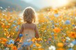 © fotofabrika - Young Girl Walking Through a Field of Flowers at Sunset