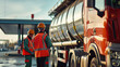 © Chatchanan - Engineers conducting a safety check on an oil tanker truck at a gas station