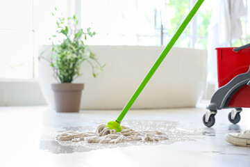 Canvas Print - Young woman mopping floor at home, closeup