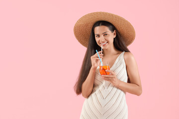 Canvas Print - Young woman with aperol spritz cocktail on pink background