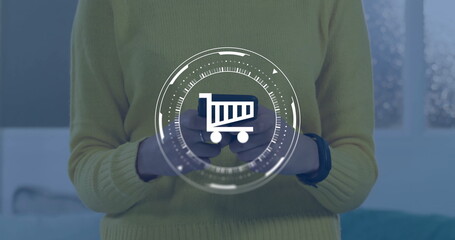 Poster - Image of data processing and shopping trolley symbol over caucasian woman using smartphone