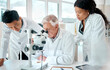 © peopleimages.com - Science, team and people with research in laboratory for medical experiment, consulting and solution. Scientist, microscope and employee with conversation for vaccine study, support or clinical trial