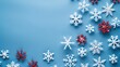 © Lala - White and red snowflakes on a blue background Christmas banner Merry Christmas and Happy New Year concept top view copy space