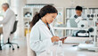 © Oostendorp/peopleimages.com - Woman, scientist and tablet for review, analysis and medical research in laboratory as employee or staff. Female person, doctor and tech for results, feedback or pathology for science or breakthrough