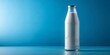 © Selene Studio - Bullet shaped milk bottle on a solid blue background, dairy, bottle, milk, fresh, drink, beverage, white, organic, health