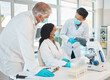 © peopleimages.com - Research, teamwork and employees in lab for healthcare innovation, medical analytics or science. Medicine, education and scientists collaboration with face mask and ppe to study liquid or chemical