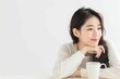 © jinna - Korean woman with a coffee mug looking relaxed whi  032 woman, beauty, hair, fashion, face, model, smile, eyes, glamour, person, skin, brunette, one, expression, smiling, people, makeup, looking, head