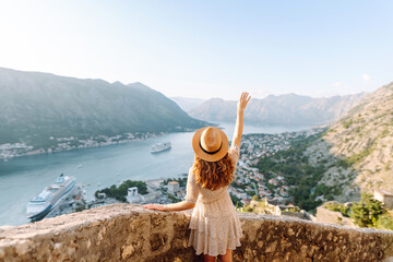 Young attractive female tourist exploring new city at summer. Europe travel. Lifestyle, vacation, tourism, nature, active life.