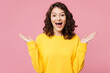 © ViDi Studio - Young surprised fun shocked excited cool woman wear yellow sweatshirt casual clothes look camera spread hands look camera isolated on pastel light pink background studio portrait. Lifestyle concept.