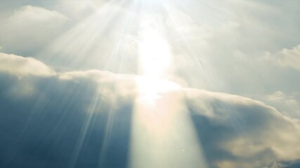 Poster - The sky is cloudy and the sun is shining through the clouds. The sun is casting a warm glow on the clouds, creating a peaceful and serene atmosphere