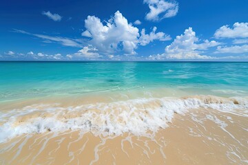 a sandy beach with a wave coming in to shore