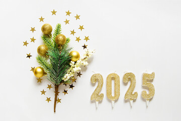 Wall Mural - festive xmas decoration gold toys, christmas tree branch, 2025 candles and stars. empty space for co