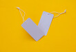 © splitov27 - Gray blank price tags on yellow background