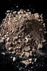 Poster - A heap of earth and stones on a dark background