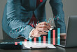 © MrPanya - Businessman drawing virtual technical graph and chart for analysis stock market, technology investment and value investment concept.