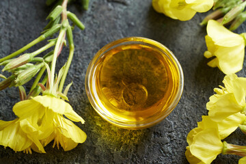 Wall Mural - A bowl of evening primrose oil - healthy nutritional supplement