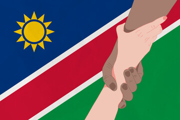 Wall Mural - Helping hand against the Namibia flag. The concept of support. Two hands taking each other. A helping hand for those injured in the fighting, lend a hand