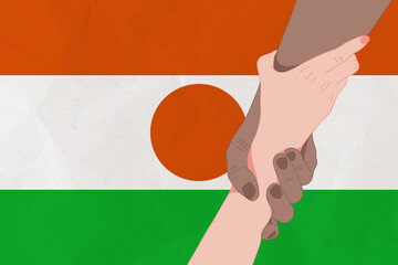 Helping hand against the Niger flag. The concept of support. Two hands taking each other. A helping hand for those injured in the fighting, lend a hand