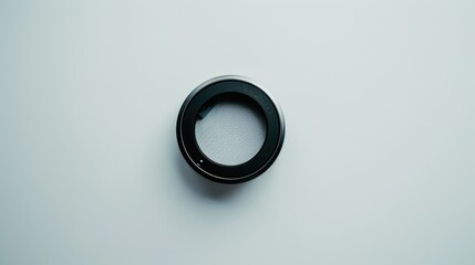 Wall Mural - Minimalist and technical composition: camera lens filter on white background