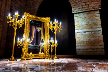 Wall Mural - golden baroque mirror with a gold candelabrum