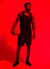 Poster - Basketball, fitness and thinking with man in red filter lighting for challenge, game or performance. Exercise, sports and training with African person in studio for competition, health or recreation
