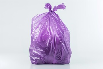 Poster - A purple plastic bag sits alone on a clean white floor, suitable for use in still life or product photography