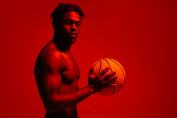 Poster - Basketball, body and fitness with man in red neon lighting for challenge, game or performance training. Exercise, health and sports with shirtless African person in studio for competition or power