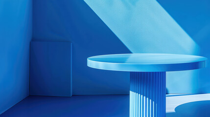 Wall Mural - A blue table sits in the center of a blue room. The table is round and has a fluted pedestal base. The room is lit by a single spotlight, which casts a shadow of the table on the wall.