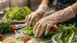 © Shaheen - a food handler wearing gloves while preparing a fresh salad, ensuring hygiene and safety.