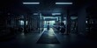 © blinkstud.io - Wide angle photography of an empty modern gym room interior full of weights, bars and racks. Artificial lighting illuminating the room, nighttime shadows, no people. Nobody.