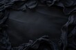 © StockUp - An abstract black background showing crumpled dark fabrics, providing a textured and moody aesthetic.