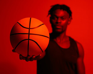 Poster - Basketball, exercise and training with man in red filter lighting for challenge, game or performance. Fitness, health and sports with African person in studio for action, competition or recreation