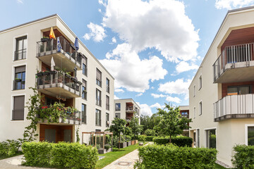 Residential area with ecological and sustainable green residential buildings, low-energy houses with apartments and green courtyard