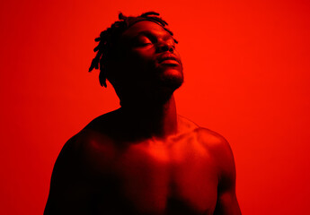 Poster - Calm, thinking and man in red lighting for fitness, wellness and memory for exercise. Athlete, confidence and inspiration or idea for workout, training and health or self care by studio background